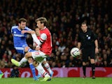 Juan Mata of Chelsea shoots to score his side's second goal during the Capital One Cup Fourth Round match against Arsenal on October 29, 2013