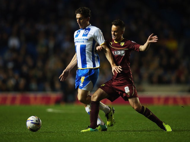 Keith Andrews of Brighton and Hove Albioin battles with Josh McEachran of Watford during the Sky Bet Championship match on October 28, 2013
