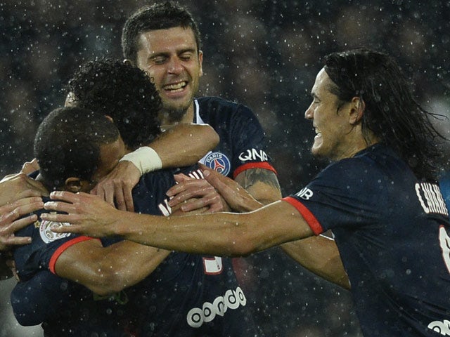 PSG's Lucas Moura is congratulated by teammates after scoring the opening goal against Lorient on November 1, 2013