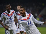Lyon's French forward Alexandre Lacazette celebrates with his teamates after scoring a goal during the French L1 football match Olympique Lyonnais (OL) vs Guingamp (EAG) on November 2, 2013