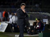 Lyon's French coach Remi Garde looks on during the French L1 football match Olympique Lyonnais (OL) vs Guingamp (EAG) on November 2, 2013