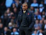 Norwich Manager Chris Hughton looks on during the Barclays Premier League match between Manchester City and Norwich City at Etihad Stadium on November 2, 2013