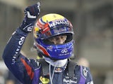 Red Bull's Mark Webber celebrates after securing pole position during qualifying for the Abu Dhabi Formula One Grand Prix on November 2, 2013