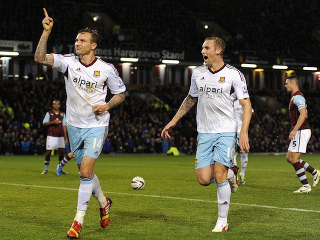 Matt Taylor of West Ham celebrates scoring the opening goal from the penalty spot during the Capital One Cup Fourth Round match against Burnley on October 29, 2013