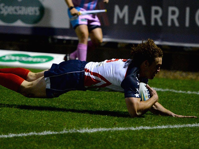 USA's Matthew Petersen scores a try against Cook Islands during their World Cup match on October 30, 2013