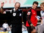 Referee Mike Dean throws down the offending object after being hit by a missile from the crowd during the Coca Cola Championship match between Cardiff City and Swansea on April 5, 2009