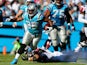 Mike Tolbert of the Carolina Panthers runs with the ball against the Atlanta Falcons during their game at Bank of America Stadium on November 3, 2013