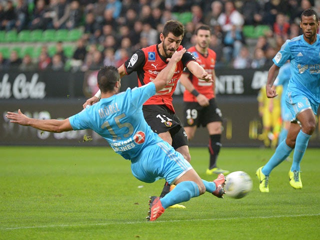 Rennes' Nelson Oliveira scores the opening goal against Marseille on November 2, 2013