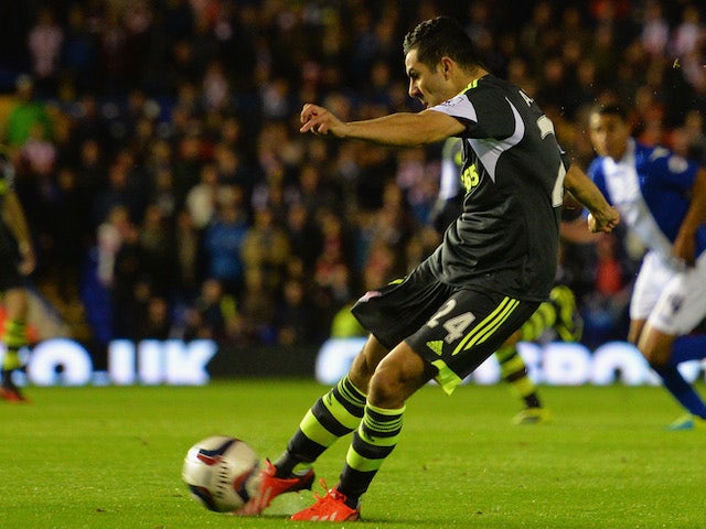 Oussama Assaidi of Stoke City scores their first goal during the Capital One Cup Fourth Round match against Birmingham City on October 29, 2013