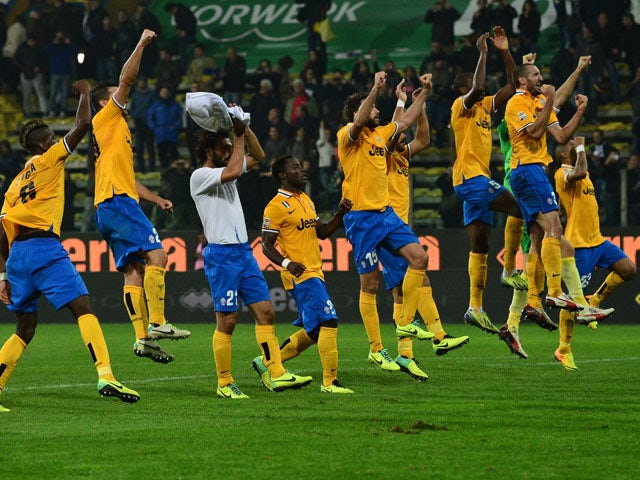 Juventus team's players celebrate at the end of their Serie A football match Parma vs Juventus at 'Tardini Stadium' in Parma on November 2, 2013