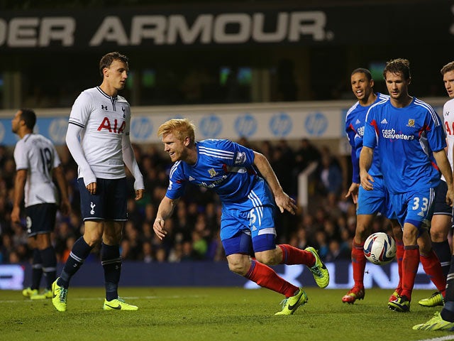 Hull's Paul McShane celebrates after scoring his team's second goal against Spurs during the Capital One Cup Fourth Round match on October 30, 2013