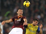 Vasilis Torosidis of AS Roma competes for the ball with Perparim Hetemaj of AC Chievo Verona during the Serie A match on October 31, 2013