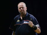 Raymond van Barneveld of the Netherlands celebrates winning a leg in his first round match against Clinton Bridge of Australia during the Sydney Darts Masters at Luna Park on August 29, 2013