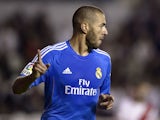 Real Madrid's French forward Karim Benzema celebrates after scoring during the Spanish league football match Rayo Vallecano vs Real Madrid at the Vallecas stadium in Madrid on November 2, 2013