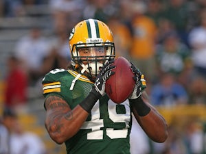 Robert Francois #49 of the Green Bay Packers participates in warm-ups before a game against the Arizona Cardinals at Lambeau Field on August 9, 2013