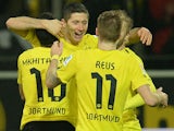 Dortmund's Robert Lewandowski celebrates with teammates after scoring his team's fourth goal against Stuttgart on November 1, 2013