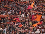  AS Roma fans support their team during the Serie A match between AS Roma and Bologna FC at the Stadio Olimpico on September 29, 2013