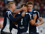 Matthew Russell of Scotland celebrates his try during the Scotland v Italy Rugby League World Cup Group C match at Derwent Park on November 3, 2013