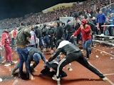 Russian football fans clash during the Russia's premier league football match Shinnik Yroslavl vs Spartak Moscow in Yaroslavl on October 30, 2013