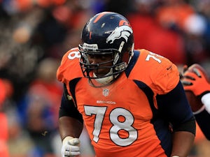 Ryan Clady #78 of the Denver Broncos pass blocks for Peyton Manning against the Baltimore Ravens during the AFC Divisional Playoff Game at Sports Authority Field at Mile High on January 12, 2013