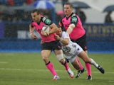 Sam Warburton of Cardiff is held by Frederic Michalak during the Heineken Cup pool 2 match between Cardiff Blues and Toulon at Cardiff Arms Park on October 19, 2013