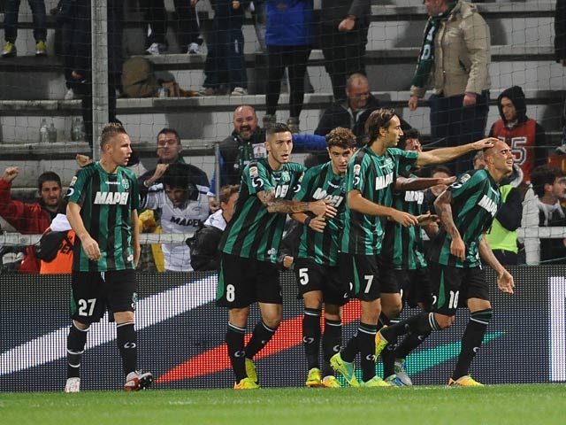 US Sassuolo Calcio's Simone Zaza is congratulated by teammates after scoring the equaliser against Udinese on October 30, 2013