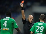 French referee Bartolomeu Varela gives a red card to Saint Etienne's French defender Kurt Zouma during the French L1 football match Sochaux (FCSM) against Saint Etienne (ASSE) on November 2, 2013