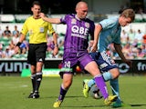 Sydney's Matthew Thompson and Perth Glory's Steven McGarry battle for the ball during their A League match on November 2, 2013