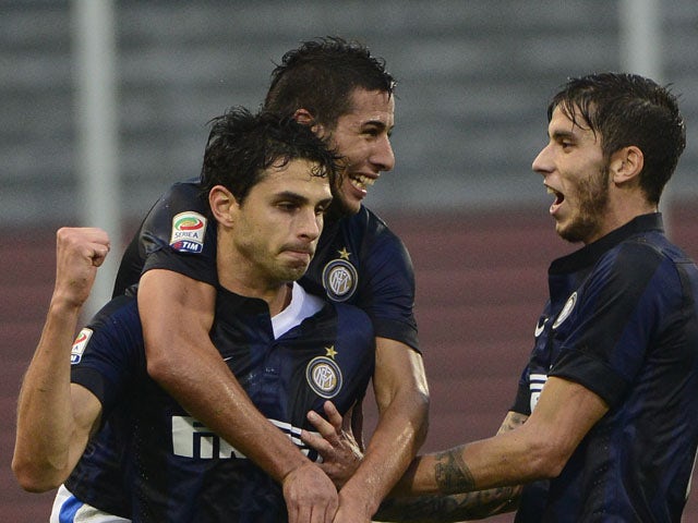 Inter Milan's defender Andrea Ranocchia celebrates with teammates after scoring during the Italian seria A football match Udinese vs Inter Milan, on November 3, 2013