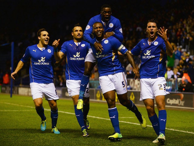 Wes Morgan of Leicester City is mobbed by team mates after scoring his goal during the Capital One Cup fourth round match against Fulham on October 29, 2013