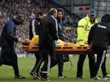 Adlene Guedioura of Crystal Palace is carried off injured during the Barclays Premier League match between West Bromwich Albion and Crystal Palace at The Hawthorns on November 2, 2013