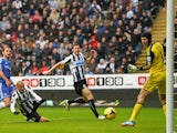Newcastle's Yoan Gouffran heads the ball past Petr Cech to score the opening goal against Chelsea on November 2, 2013