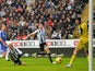 Newcastle's Yoan Gouffran heads the ball past Petr Cech to score the opening goal against Chelsea on November 2, 2013