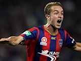 Adam Taggart of the Jets celebrates a goal during the round four A-League match between the Newcastle Jets and the Central Coast Mariners at Hunter Stadium on November 2, 2013