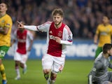 Ajax's Danish midfielder Lasse Schone celebrates scoring his team's first goal during the UEFA Champions League group H football match between Ajax Amsterdam and Celtic FC on November 6, 2013