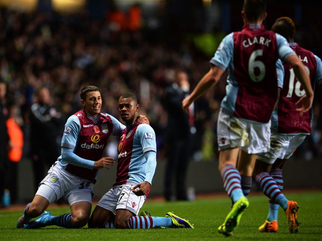 Leandro Bacuna of Aston Villa is congratulated by teammates after scoring the opening goal during the Barclays Premier League match between Aston Villa and Cardiff City at Villa Park on November 9, 2013