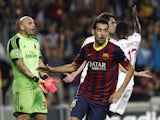 Barcelona's midfielder Sergio Busquets celebrates after scoring a goal during the UEFA Champions league football match FC Barcelona vs AC Milan at Camp Nou stadium in Barcelona on November 6, 2013
