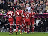 Bayern Munich's French midfielder Franck Ribery celebrates his goal with teammates during during German first division Bundesliga football match FC Bayern Munich vs FC Augsburg in the southern German city of Munich on November 9, 2013