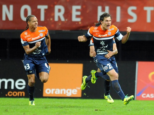 Montpellier's French defender Benjamin Stambouli celebrates with teammates after scoring a goal during a French L1 football match against Valenciennes on November 9, 2013