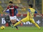 Panagiotis Kone # 33 of Bologna FC competes the ball with Marcelo Estigarribia # 20 of AC Chievo Verona during the Serie A match between Bologna FC and AC Chievo Verona at Stadio Renato Dall'Ara on November 4, 2013