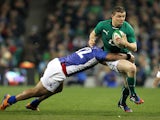 Ireland's centre Brian O'Driscoll is tackled by Samoa's centre Johnny Leota during the International rugby union test match between Ireland and Samoa on November 9, 2013