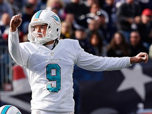 Caleb Sturgis of the Miami Dolphins watches his field goal in the 2nd quarter against the New England Patriots in the first half at Gillette Stadium on October 27, 2013