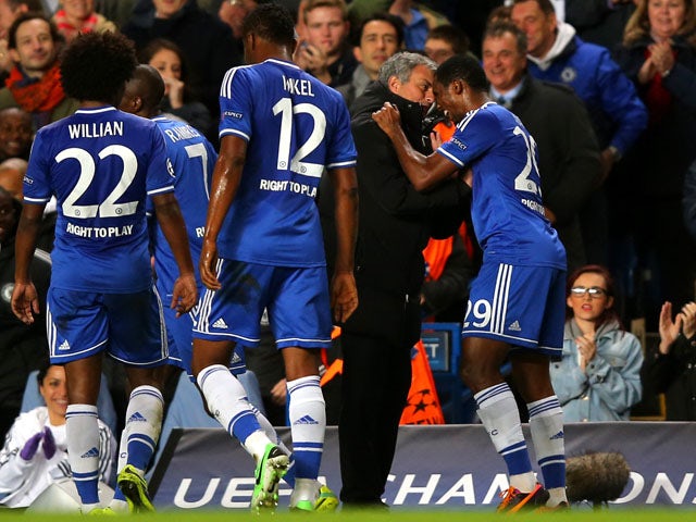 Samuel Eto'o of Chelsea celebrates with Jose Mourinho the Chelsea manager after scoring the opening goal during the UEFA Champions League Group E match between Chelsea and FC Schalke 04 at Stamford Bridge on November 6, 2013