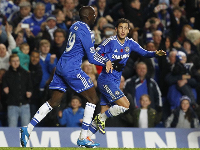 Eden Hazard of Chelsea celebrates with team mate Demba Ba after scoring the equaliser during the Barclays Premier League match between Chelsea and West Bromwich Albion at Stamford Bridge on November 09, 2013