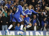Eden Hazard of Chelsea celebrates with team mate Demba Ba after scoring the equaliser during the Barclays Premier League match between Chelsea and West Bromwich Albion at Stamford Bridge on November 09, 2013