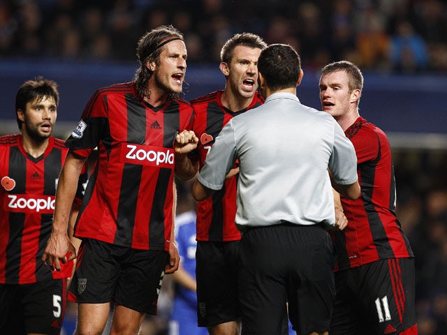 West Brom trio Jonas Olsson, Gareth McAuley and Chris Brunt appeal to referee Andre Marriner after he awards a late penalty to Chelsea during the Barclays Premier League match between Chelsea and West Bromwich Albion at Stamford Bridge on November 09, 201