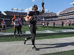Tight end Dallas Clark of the Baltimore Ravens celebrates after scoring a touchdown against the Cincinnati Bengals in the first quarter at M&T Bank Stadium on November 10, 2013