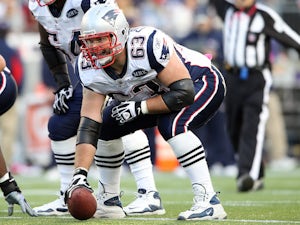 Dan Connolly of the New England Patriots waits for Tom Brady's signal in the first half against the Dallas Cowboys on October 16, 2011