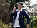 Former England cricketer and television commentator David 'Bumble' Lloyd poses in his MCC jacket and England cap at his home on April 23, 2013
