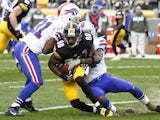 Emmanuel Sanders of the Pittsburgh Steelers is tackled by Jairus Byrd of the Buffalo Bills during the game on November 10, 2013